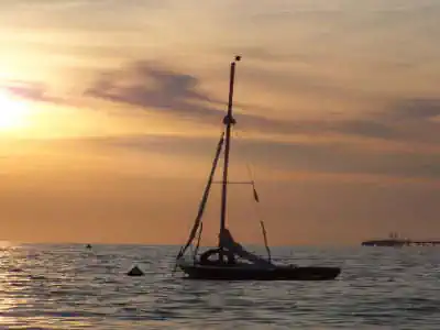 Camping on the sea Tuscany Camping RadaEtrusca sunset directly on the sea vada sailboat Tuscany